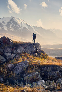 Hiker with big backpack in the mountains