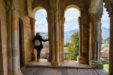 Tourist woman enjoying the breathtaking views seen from Mount Naranco in Oviedo, Asturias.