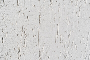 Obraz premium The surface of the wall with the texture of decorative plaster. 