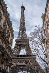 Man on Street in Paris with the Eiffel Tower Paris, France.