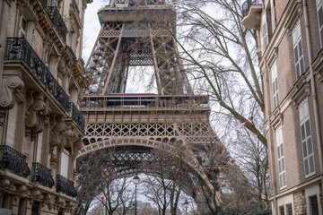 Fototapeta na wymiar Man on Street in Paris with the Eiffel Tower Paris, France.