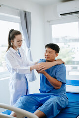 Doctor consulting with patient Back problems Physical on the bed in clinic therapy concept 