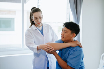 Doctor consulting with patient Back problems Physical on the bed in clinic therapy concept 