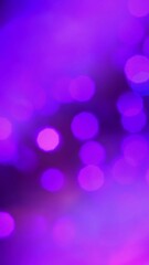 Pink purple blue magenta bokeh on a dark background. Background for design