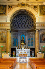 Fototapeta na wymiar Main nave and altar of Our Lady of Port Church Eglise Notre Dame du Port in historic Nice Port and yacht marina district on French Riviera in France