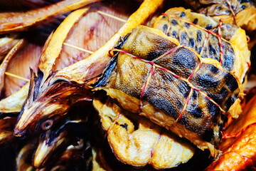 Smoked fish on the counter in the store. Trade in seafood in the market and in the trading network. Close-up