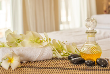 The combination of spa oil and a towel can be used for at home self massage to relieve tension and promote relaxation.
