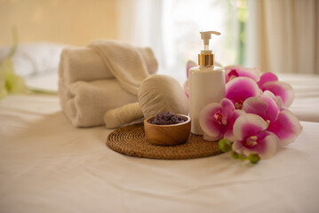 The composition of the compress ball, spa salt cup and lotion bottle reflect the readiness for spa...