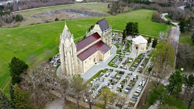 Gothic Parish Of Assumption Church And Cemetery In Bad Deutsch-Altenburg, Lower Austria. Aerial Drone Shot