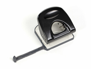 Black office puncher over white background