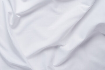 White fabric. luxurious white fabric texture background. Creases of satin, silk and cotton.