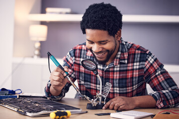 Black man, technician and fixing computer circuit board in hardware, soldering iron tools or tech...