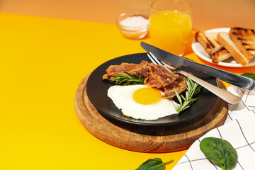 Fried bacon and egg - tasty breakfast composition