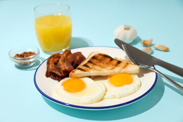 Fried bacon and egg - tasty breakfast composition