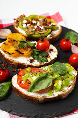 Toasts with tasty grilled vegetables, concept of delicious appetizer
