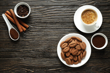 Concept of tasty snack for hot drink - cookies in the shape of coffee seeds
