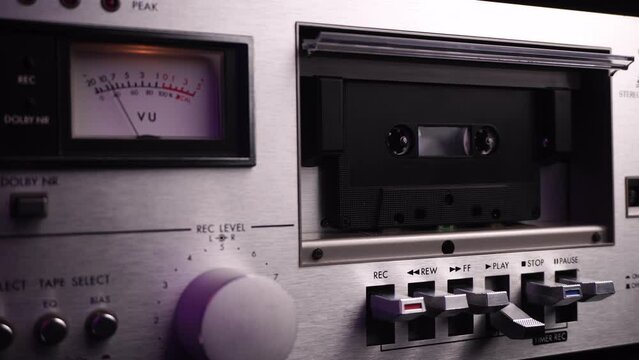 Close Up of Audio Cassette Player With Black Tape Playback