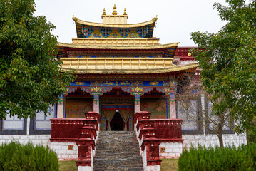 Beautiful gold-roofed red-lacquered Tibetan Buddhist monastery in Tibet