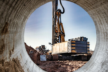 Hydraulic drilling machine in excavation at the construction site. Modern drilling rig. The device...