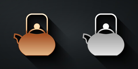 Gold and silver Kettle with handle icon isolated on black background. Teapot icon. Long shadow style. Vector