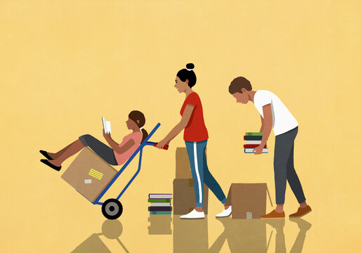 Family reading, packing and moving boxes of books with hand truck
