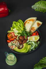 A bowl of food with a plate of food on it