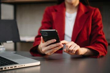 Businesswoman hand using laptop, tablet and smartphone in office. Digital marketing media mobile app and discussing plan new start up project.