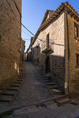Fototapeta na wymiar Typical street in the old town of the medieval village of Sos del Rey Catolico, Huesca province, Aragon, Spain.