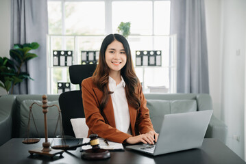 justice and law concept.Female judge in a courtroom on wooden table and Counselor or Female lawyer working in office.