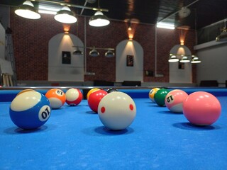 Pool balls on blue table sport game set