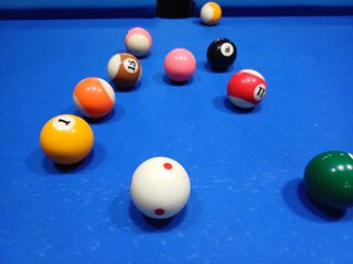 Pool balls on blue table sport game set