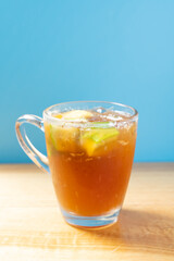 side view glass cup of iced lemon vertical composition