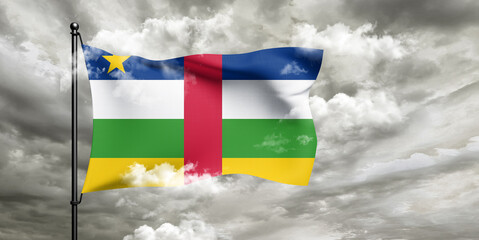 Central African Republic. national flag cloth fabric waving on beautiful sky grey Background.