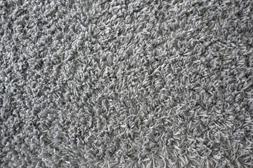Fluffy grey carpet. Grey texture background 