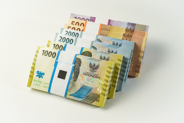 Jakarta, Indonesia, April 15, 2023, various bundles of Indonesian rupiah banknotes in the IDR currency thousands copy space thr zakat