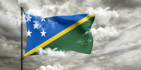 Solomon Islands national flag cloth fabric waving on beautiful sky grey Background.