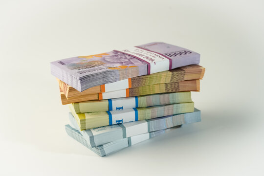 Jakarta, Indonesia, April 15, 2023, various bundles of Indonesian rupiah banknotes in the IDR currency thousands copy space thr zakat
