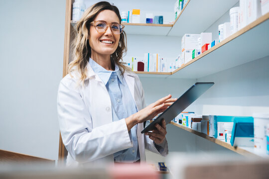 Woman using a tablet in a pharmacy