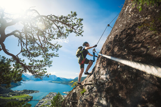 Low angle view of rock climber