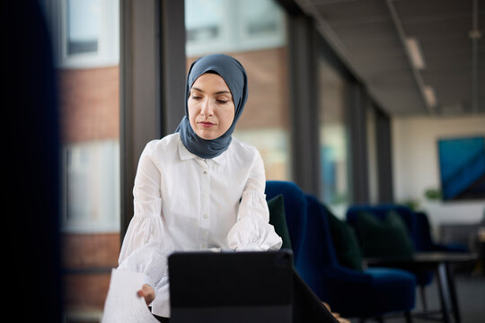 Businesswoman in hijab working in office