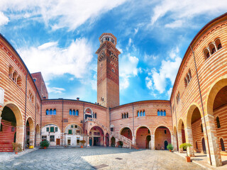 Obraz premium Gorgeous View Torre dei Lamberti clock tower and Medieval stairs of Palazzo della Ragione palace building in Verona.