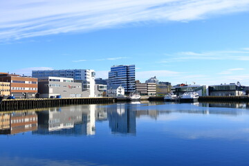 Fototapeta na wymiar May 28 2022 - Tromso, Norway: Modern residential and business buildings in the city