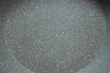 pan with non-stick coating top view, close-up texture of the non-stick layer