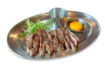 Top view of Grill Sirloin beef topped with fish sauce and fresh egg and onion, focus selective