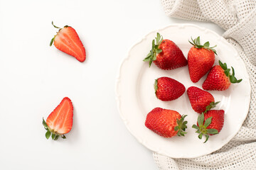 Fresh strawberries on a plate with flowers