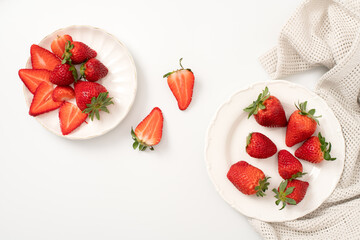 Fresh strawberries on a plate with flowers