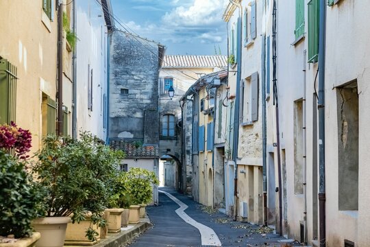 A beautiful shot of an alley with historic buildings in Uzes, France