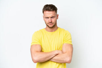 Fototapeta premium Young blonde caucasian man isolated on white background with unhappy expression