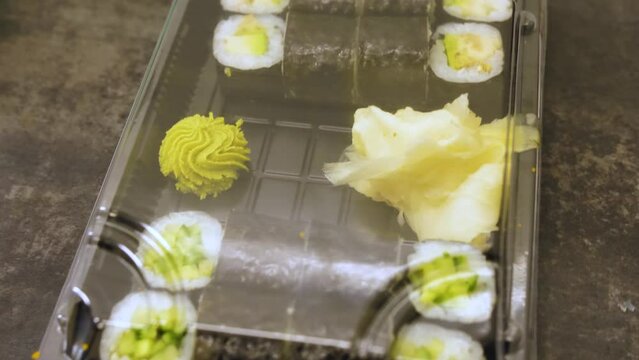 Sushi and rolls set in a plastic box. Delivery service, food stock footage