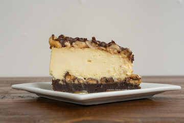 Slice of chocolate caramel cheesecake